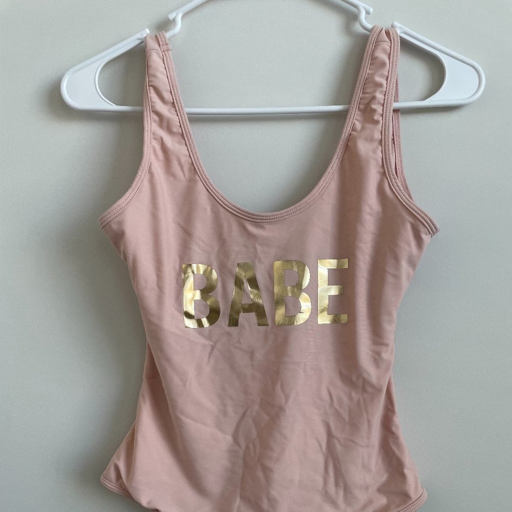Light pink one piece bathing suit